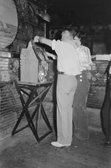 Slot Prints: Couple playing slot machine, Raceland, Louisiana