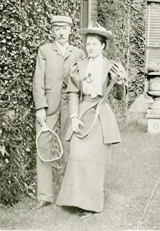 Racket Prints: Couple posing with tennis rackets
