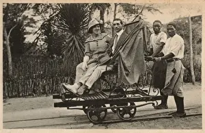 Rails Prints: Couple riding trolley, Beira, Mozambique, East Africa