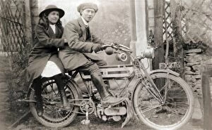 Triumph Gallery: Couple sitting on 1905 Triumph motorcycle