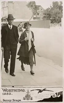Snaps Prints: Couple strolling down a street in Worthing - Sunny Snaps