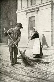 Finnish Gallery: Couple sweeping a street, Helsingfors, Finland