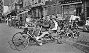 Artois Collection: Couple on a two-seater cycle, Belgium