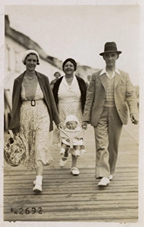 Conveyance Gallery: Couple with young baby between them, followed by Granny