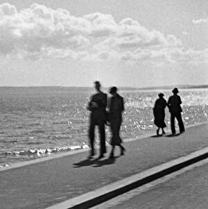 Seafront Gallery: Couples on sea front, English south coast