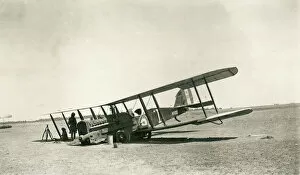 Iraq Gallery: Crashed biplane with crew resting in the desert, Iraq
