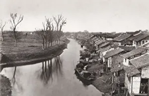 Creek, river, near Shanghai, China, houses on the river bank