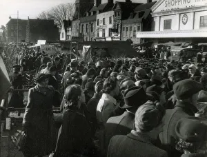 A crowd scene on a busy market day at Romford Market, Essex, England. Date: 1950s
