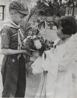 Cub Scout receiving flowers, Taipei, Formosa