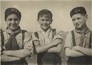 Three cub scouts on an outdoor activity