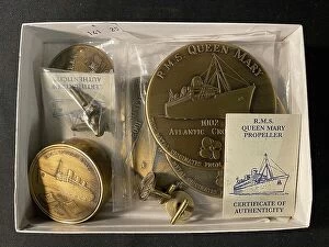 Images Dated 19th February 2021: Cunard Line, RMS Queen Mary - souvenir brass items