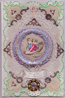 Cupids and flowers on a paper lace romantic card Cupids and flowers on a paper lace romantic card