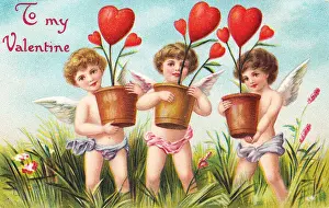 Cupids with red hearts on a Valentine postcard