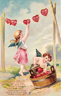 Cupids with red hearts on a Valentine postcard