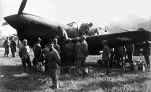 Manually Prints: Curtiss P-40B being manually refuelled of AVG