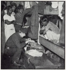 Duties Prints: A customs official from the flying squad searches the quarters of a Lascar crew of a sugar freighter to check no