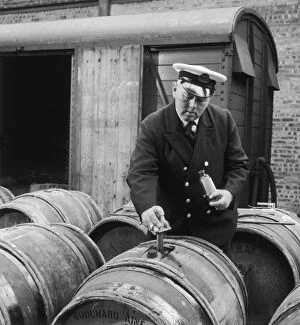 Imported Gallery: Customs official tests imported wine