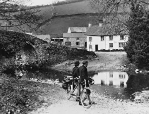 Cyclists Rest at Bridge