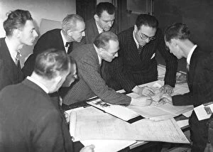 Documents Collection: Daily Worker staff examining building alteration plans