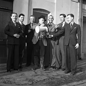 Images Dated 2nd April 2012: Darts Team celebrate with a jug of ale, Walton, Essex