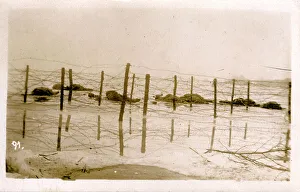 Barbed Prints: Dead Russian Soldiers on Beach - Barbed Wire Barrier