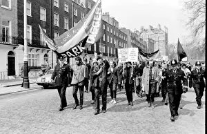 Demonstration in London -- young protesters walking along a road with a banner belonging