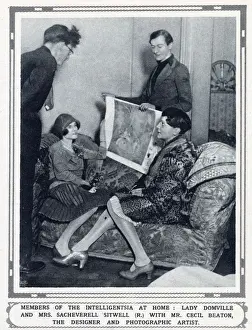 Fashions Prints: The designer and photographic artist Cecil Beaton (standing - r) showing costume designs to Lady Domville (seated)