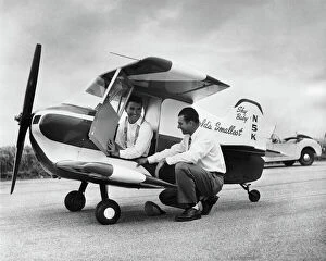 1957 Collection: Designer Ray Stits Kneeling by and Test-Pilot Bob ( Robe?