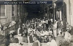 Families Prints: Dining families at Alfi Bey Street, Cairo