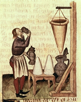 Distilling alcohol. Illustration from Tractatus Distilling alcohol. Illustration from Tractatus