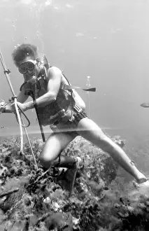Divers Prints: Diver with underwater house off the coast of Malta