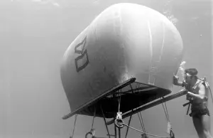 Diver with underwater house off the coast of Malta