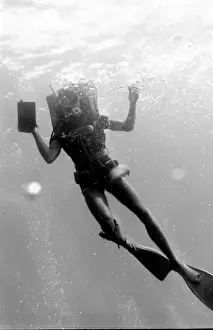 Anchored Prints: Diver underwater off the coast of Malta