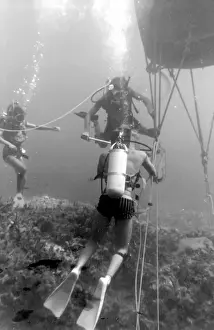 Divers with underwater house off the coast of Malta