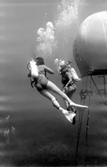 Divers with underwater house off the coast of Malta