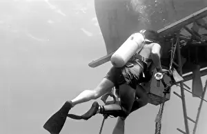 Divers with underwater house off the coast of Malta