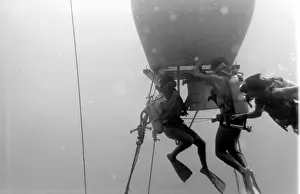 Divers with underwater house off the coast of Malta