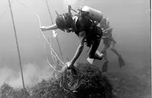 Divers with underwater house off the coast of Malta