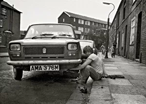 DIY mechanic fixing car, Eccles, Manchester