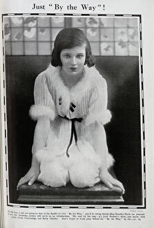 Hurst Collection: Dorothy Hurst, actress, theatrical studio portrait, kneeling, in pale costume with down trim