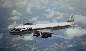 Aloft Prints: Douglas DC-7 of Delta (forward view) aloft