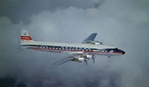 Douglas DC-7B of National (forward view) aloft
