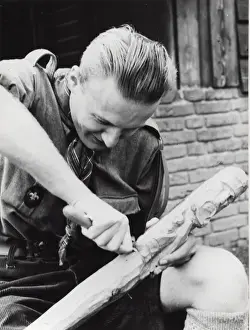 Sculpting Prints: Dutch boy scout carving wood, Holland
