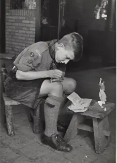 Follow Prints: Dutch boy scout making model animal, Holland