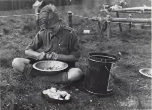 Culinary Prints: Dutch boy scout preparing vegetables, Holland