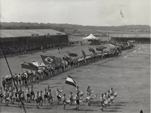 Drumming Collection: Dutch boy scouts on a parade ground with flags