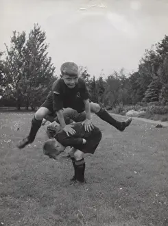 Dutch boy scouts playing leapfrog, Holland