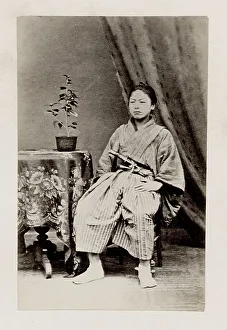 Early Japanese portrait: seated man with sword