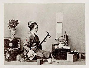 Early Japanese portrait: woman playing shamisen