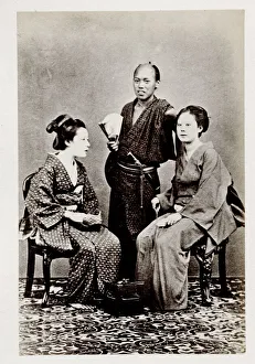 Early portrait Japan - man and two seated women